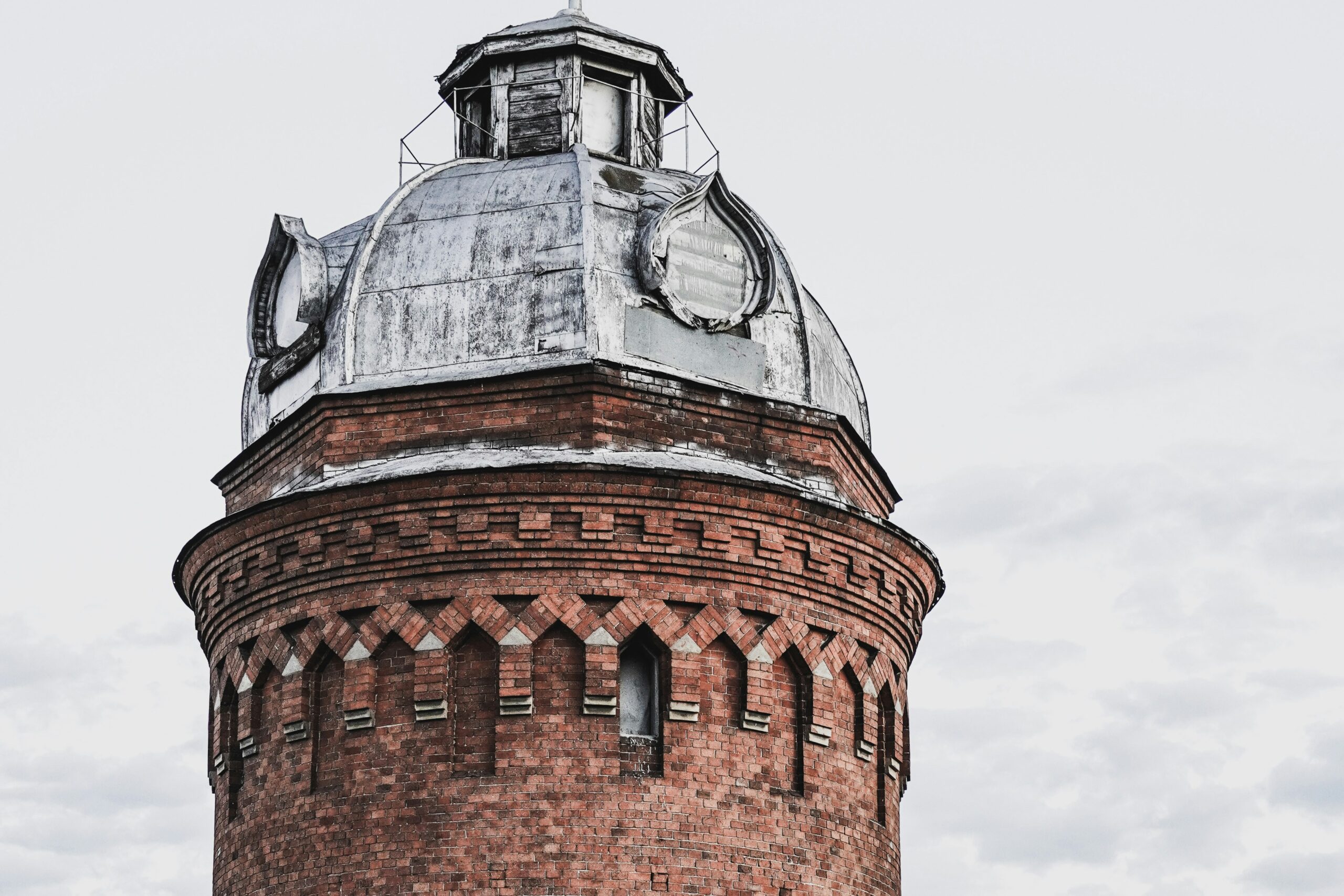 brown brick building under white sky